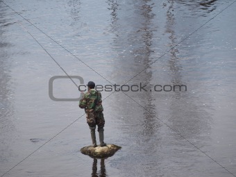 Fisherman on the stone
