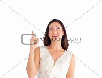 Suprised Young Beautiful Business woman pointing upwards