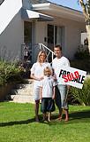 Happy Family holding Sold Sign