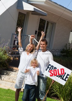 Family happy to have bought a home