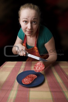 woman with salami instead of hand