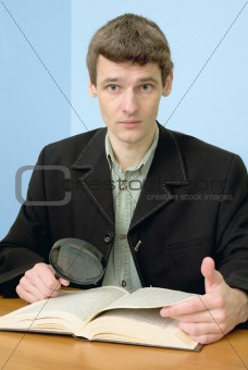 Man read book on a workplace