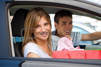 people in car after shopping
