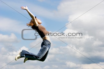jumping girl on sky background