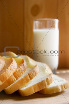 bread and milk on wooden background