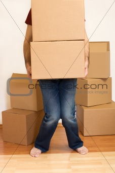 Man struggling with cardboard boxes - moving concept