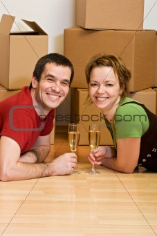 Couple toasting in their new home