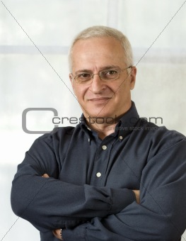 Portrait of a senior businessman with arms crossed
