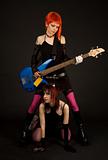 Two attractive girls with guitar 