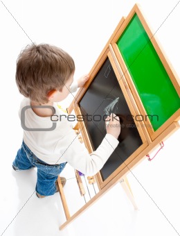 Boy drawing on blackboard