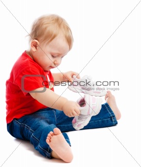 Baby trying on trainers
