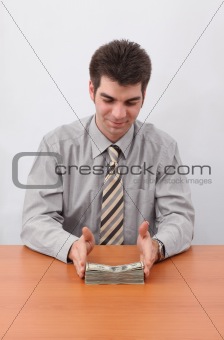 Businessman And Stack Of Money