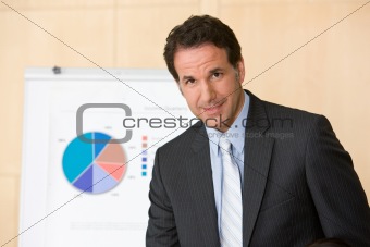 confident business man with report in background