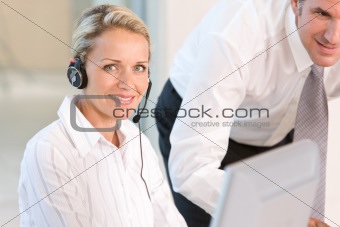 Face of young charming confident woman with headset