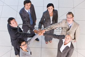 Portrait of business people  holding hands