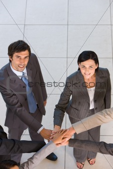 Portrait of business people  holding hands