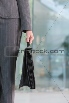 business woman carrying briefacse
