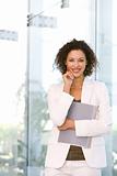 Portrait of attractive business woman holding folder