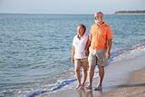 Senior Couple - Romantic Beach Stroll