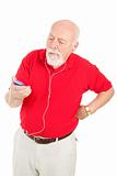 Senior Man Annoyed by MP3 Player
