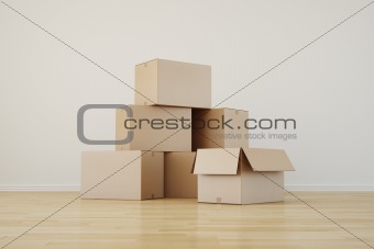 Cardboard boxes in empty room