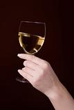 glass of white wine in hand