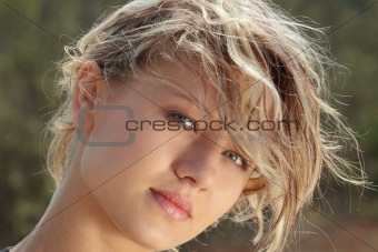 Blond fitness girl in wind portrait 