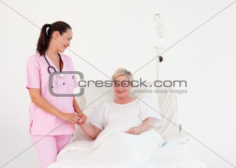 Nurse measuring a patients Pulse