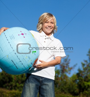 Boy holding a globe