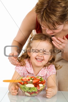 Happy kid with fruit salad