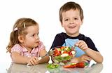 Kids eating fruit salad