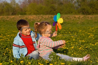 Kids playing on the spring flower field