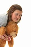Beautiful teenager holding a teddy bear