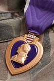 Purple Heart War Medal on Camouflage Material