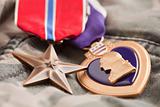 Bronze and Purple Heart Medals on Camouflage Material