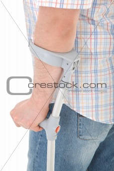 man walking with a crutch 