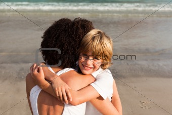 Young boy hugging his mother