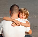 Young Boy Hugging his father 