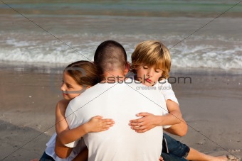 Children hugging their father