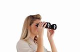 Young woman looking through Binoculars