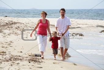 young happy family on the beach
