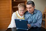 Senior couple on laptop