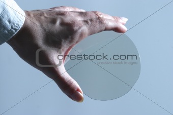 Translicent microchip plate in womans hand