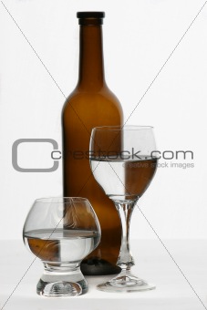 brown bottle and glasses