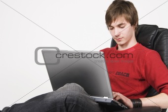 young man working at computer