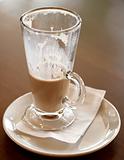 Coffee Latte in a tall glass half empty