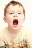 The boy with the open mouth on a white background