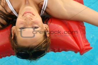 Woman swimming an air matress