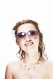 Cute young woman wearing sunglasses and shark necklace on white - surfer's girlfriend
