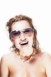 Cute young woman wearing sunglasses and shark necklace on white - surfer's girlfriend